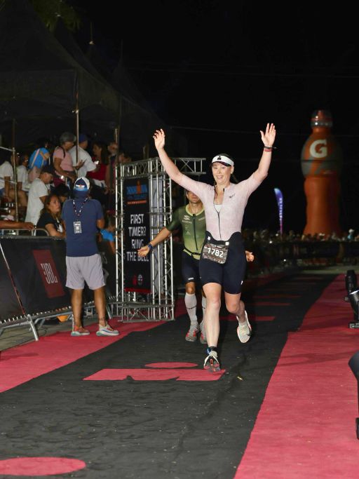 Ironman Cozumel race report: running down the finisher chute.