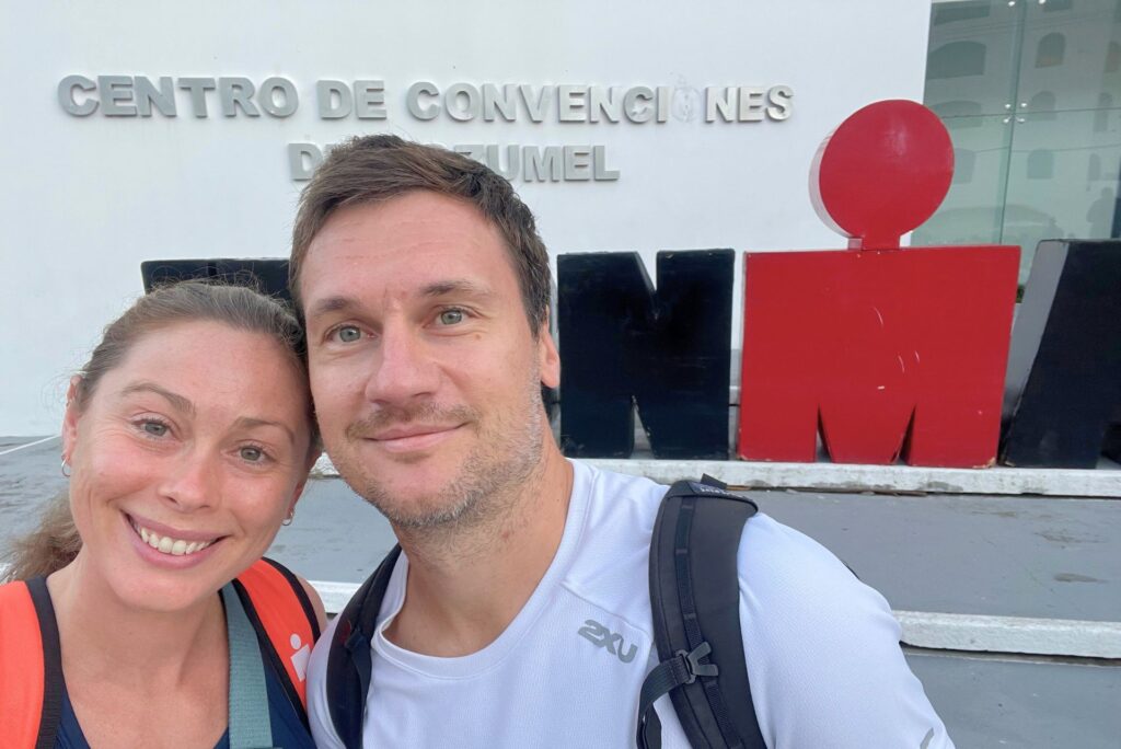 Posing in-front of the Ironman Sign at athlete check-in, in Cozumel.