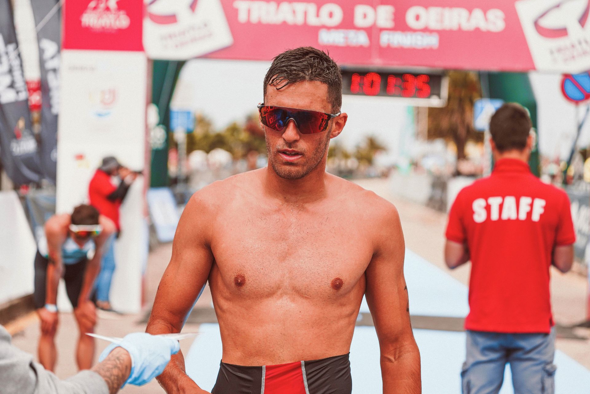 A triathlete at the finish line of a race.
