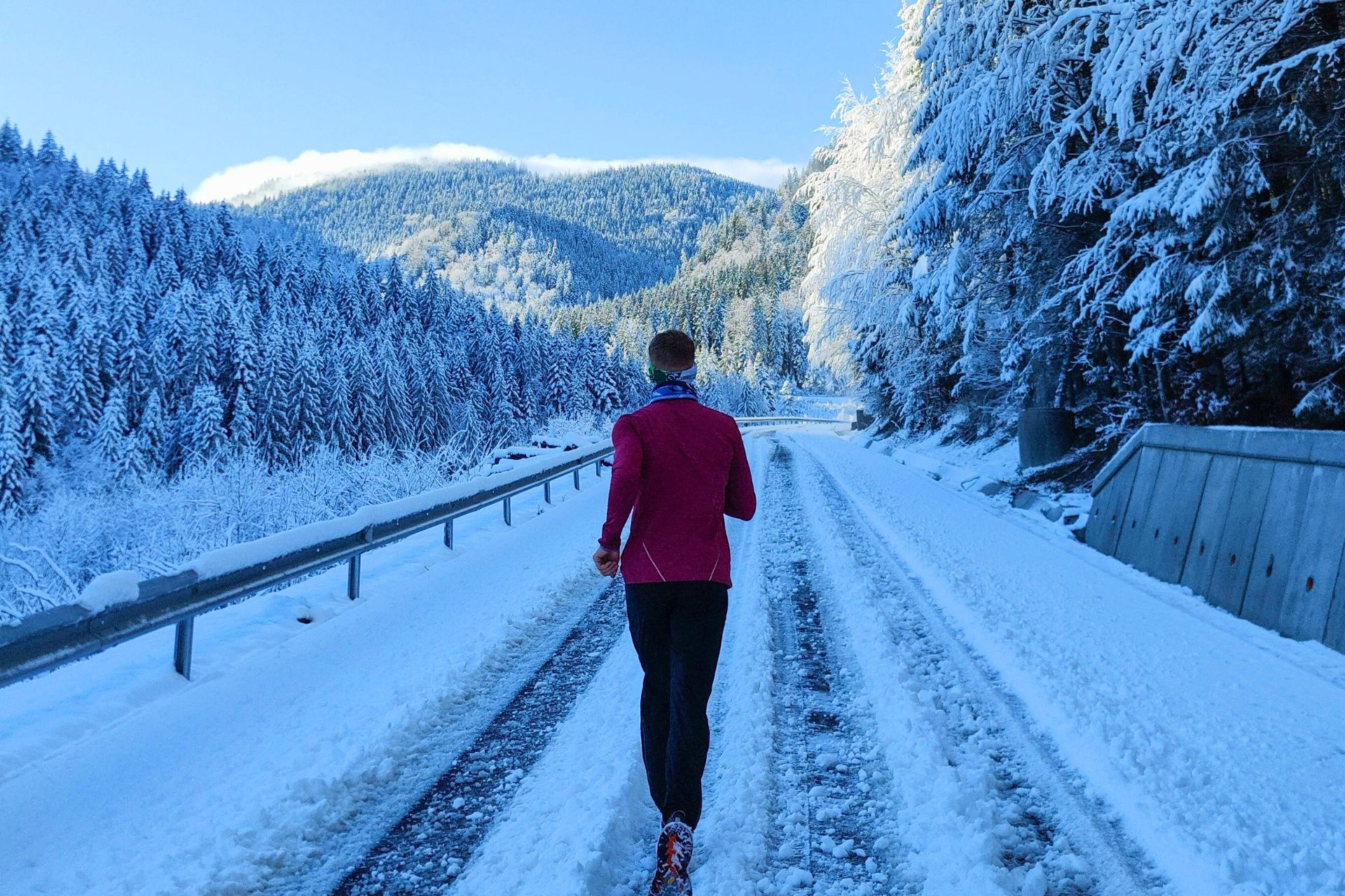 How cold is too cold to run outside? A runner jogging in the snow.